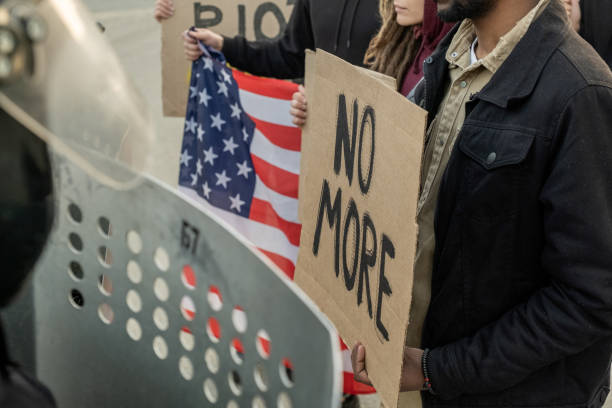 istock People with Signs Urging Government 1328281694