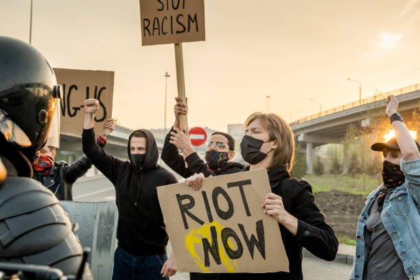 istock Group of protesters on road 1328281707
