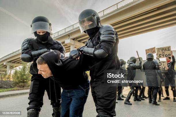Riot Police Twisting Man At Rally Stock Photo - Download Image Now - Russia, Protest, Protestor
