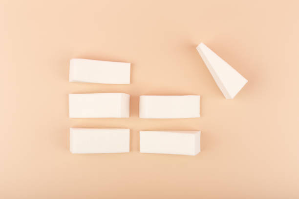 istock Flat lay with triangle shaped make up sponge son pastel beige background 1328282349