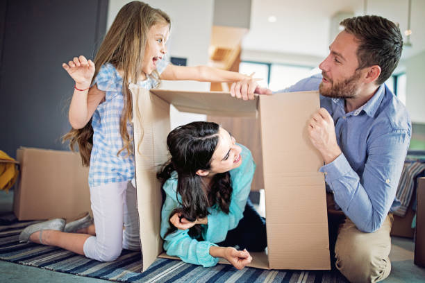 istock Happy family moving into new home 1328283845