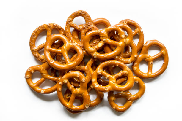 salt pretzels isolated on white background - pretzel snack salty food imagens e fotografias de stock