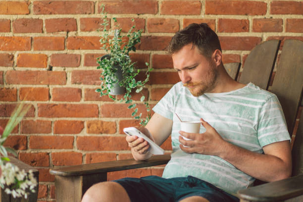 istock Young man using mobile phone. The concept of lifestyle mobility and modern wireless communication technologies 1328286322