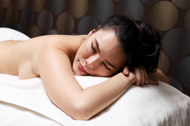 istock Close-up beautiful woman's sleeping and doing spa in a beauty salon. 1328287275