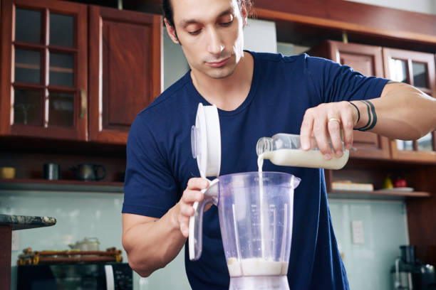 istock Sportsman Making Protein Cocktail 1328289807