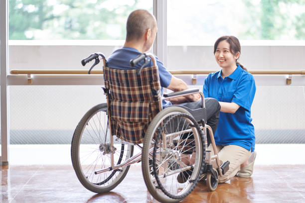 istock Wheelchair-riding elderly and caregivers 1328289949