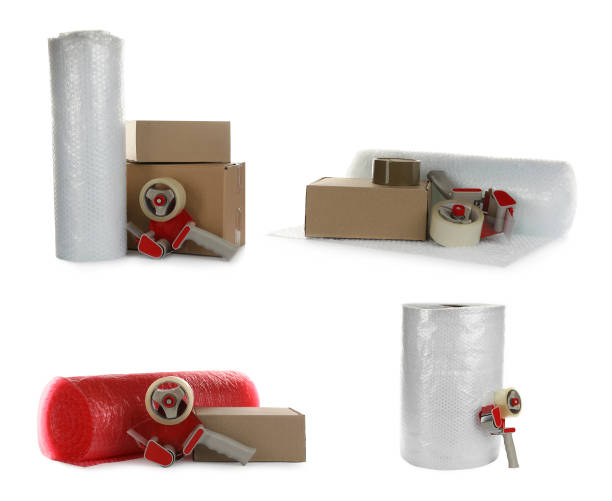 istock Set with bubble pack rolls, cardboard boxes and tape dispensers on white background 1328290745