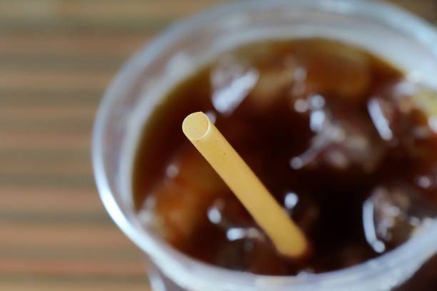 istock Selective focus of bio drinking straw in a ice coffee glass. 1328292684