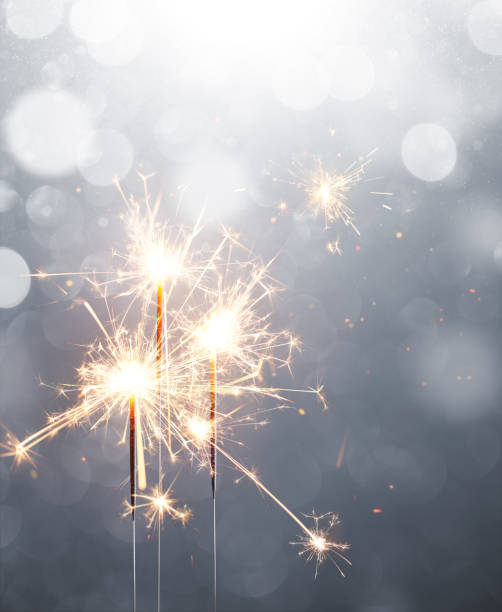 Glittering sparklers, Merry Christmas and Happy New Year Glittering sparklers, Merry Christmas and Happy New Year sparkler stock pictures, royalty-free photos & images