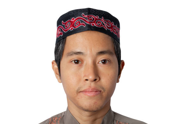 istock muslim man wearing kopiah hat isolated on white background. clipping path. 1328294145