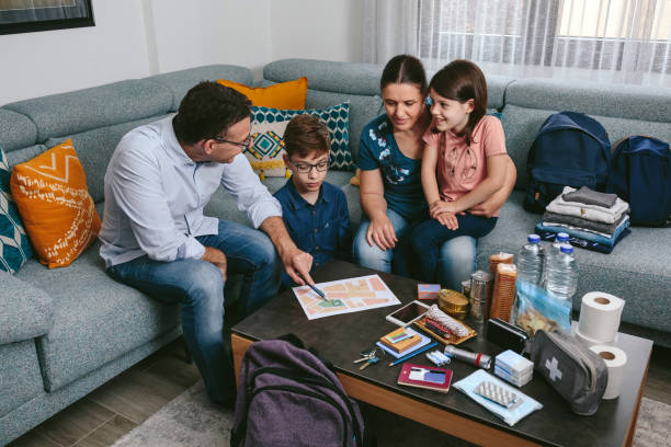 istock Father explaining to his family the emergency assembly point 1328295379