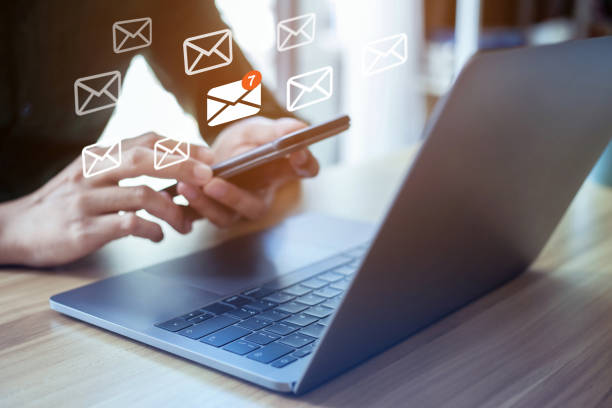 istock email marketing concept, closeup hand using laptop with email icon, massages icon on virtual screen. 1328295523