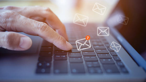 istock email marketing concept, closeup hand using laptop with email icon, massages icon on virtual screen. 1328295530