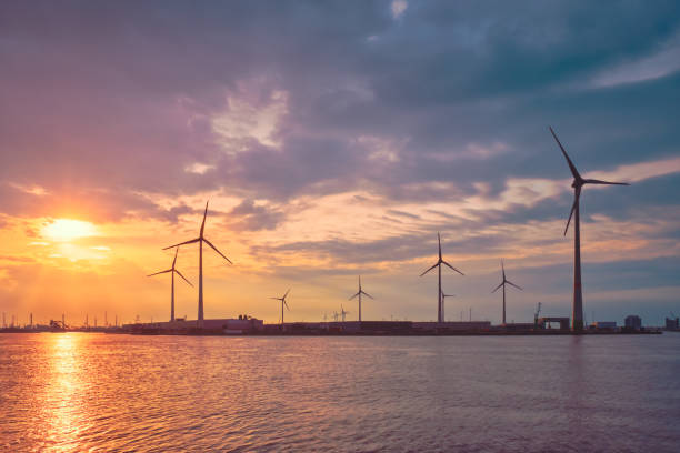 istock Wind turbines in Antwerp port on sunset. 1328295539