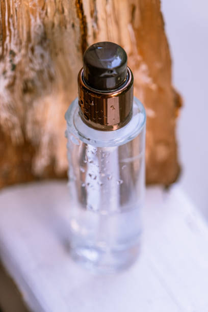 istock A transparent bottle with a cosmetic product in a composition with bark 1328298001