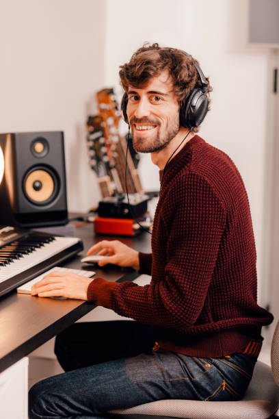 istock Music producer working at home music studio looking at camera 1328298998
