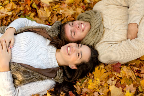 istock romantic couple in the autumn park 1328299146