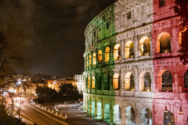 istock coliseum in rome with italian flag 1328299242