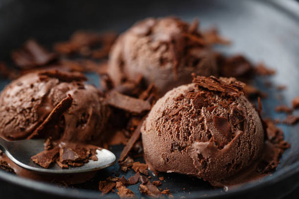 istock Tasty appetizing chocolate ice cream with chocolate chunks on dark plate 1328301510