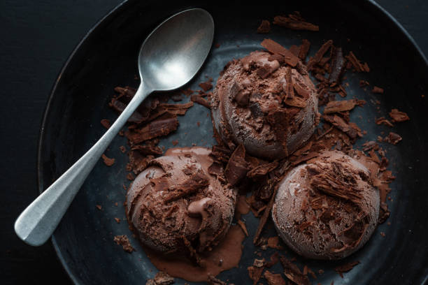istock Tasty appetizing chocolate ice cream with chocolate chunks on dark plate 1328301751