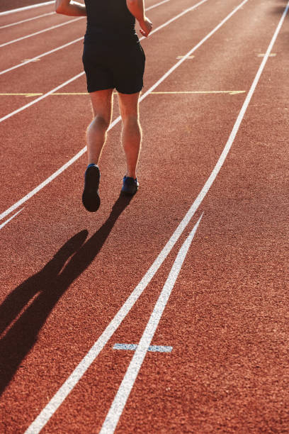 istock Back view of young sportsman running 1328302148
