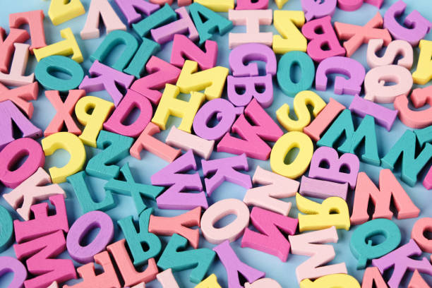 istock Lots of scattered multicolored letters. Learning to read, alphabet. 1328304318
