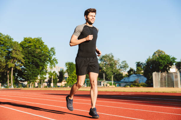 istock Motivated young sportsman running 1328304321