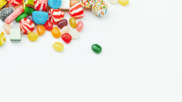 multi-colored gummy candies on a white background. festive frame backdrop. - gum drop copy space sweet food gelatin dessert imagens e fotografias de stock