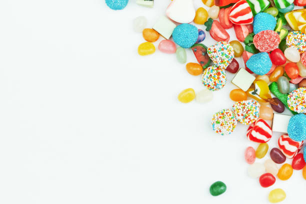 multi-colored gummy candies on a white background. festive frame backdrop. - gum drop copy space sweet food gelatin dessert imagens e fotografias de stock