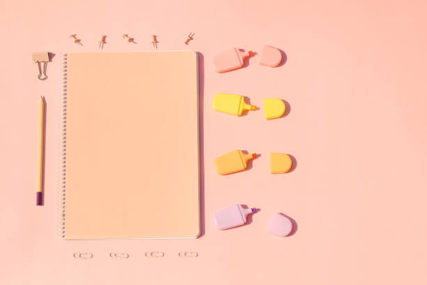 istock Minimalistic creative Back to school bright concept, frame with colorful school supplies and notebook on pink peach background 1328304792