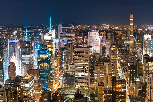New York aerial view at night, cityscape from helicopter in Manhattan - Skyscrapers and streets with lights - Travel and architecture concepts in New York city, United States