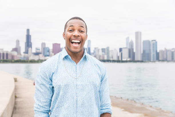 istock Happy black man laughing and looking at camera 1328305152