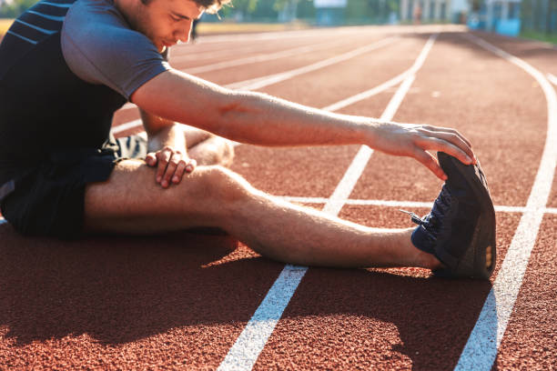istock Cropped image of strong sportsman doing stretching 1328306574