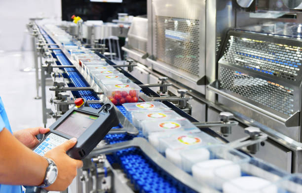 istock Manager check and control automation Food products boxs transfer on Automated conveyor systems in factory 1328306711