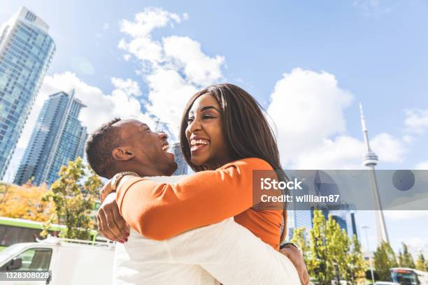 Happy black couple having fun in Toronto city