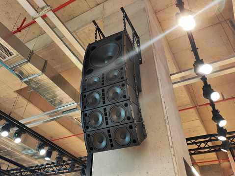 Sound and lighting equipment, speaker and spotlights hanging on the wall