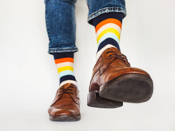 istock Men's legs, trendy shoes and bright socks 1328310676