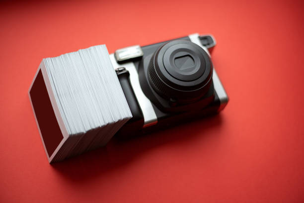 istock Instant print camera and photos on a red background 1328311008