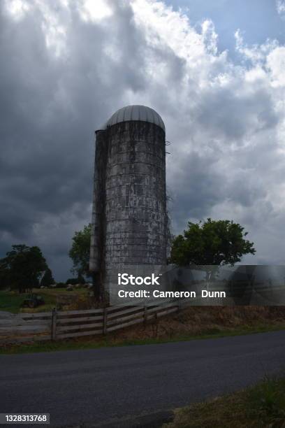 Daleville Va Usa June 27 2021antique Corn Silo And John Deere Tractor Fenced In Rural Farmlands Stock Photo - Download Image Now