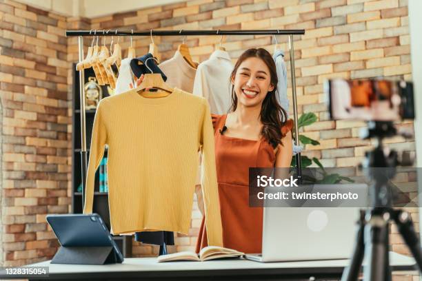 Woman Influencer Selling Clothes Online Stock Photo - Download Image Now - Selling, Live Streaming, Entrepreneur