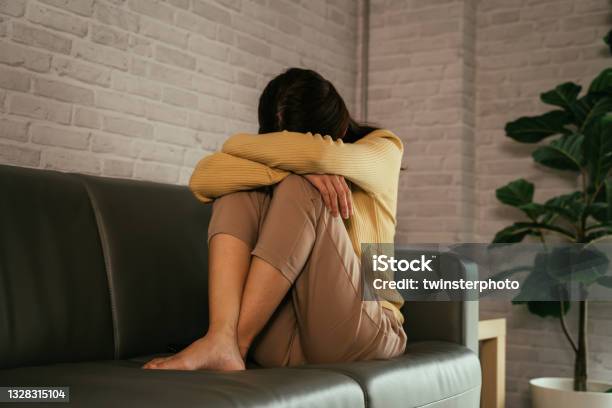 Depressed Woman Crying At Home Stock Photo - Download Image Now - Worried, Women, Japanese Ethnicity