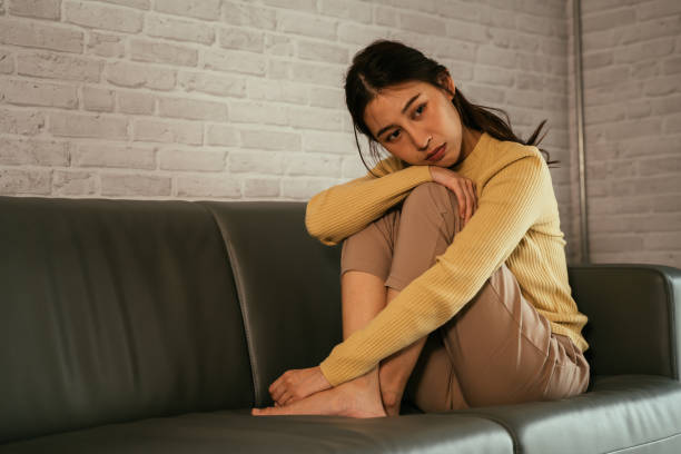 istock Sad and depressed woman at home 1328315107