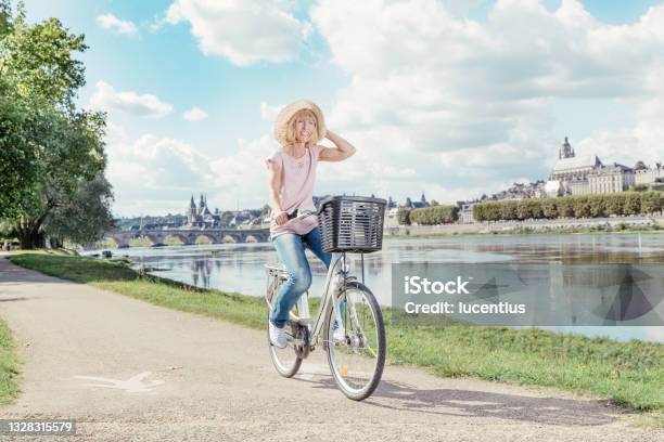 Mature Woman Cycling Loire Valley France Stock Photo - Download Image Now - Loire Valley, Loire River, Bicycle