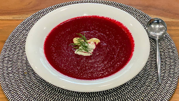 Hot beetroot soup with horseradish and dill served with sour cream