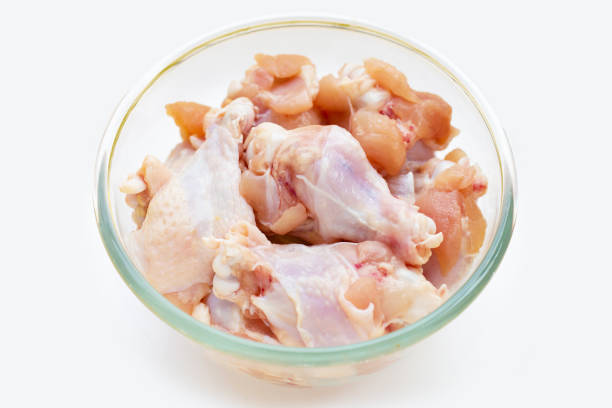 istock Fresh raw chicken wings (wingstick) in glass bowl on white background. 1328322495