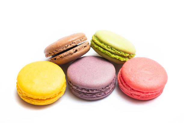 istock Various flavors of pastel macarons stacked against isolated on white background. 1328322843