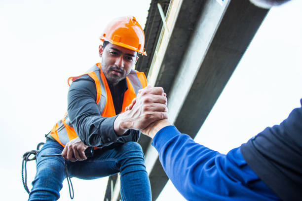 istock asian Inspector Engineering wearing helmet and vest worker unifrom checking railway construction work on rail track. 1328323750