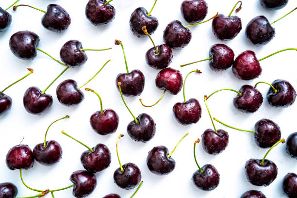istock Cherry fruits fresh with dew water drops isolated on white 1328323803