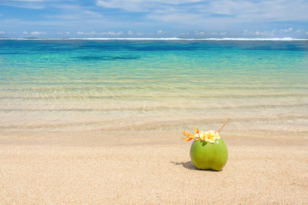 istock Coconut cocktail decorated with flowers on the beach 1328324941