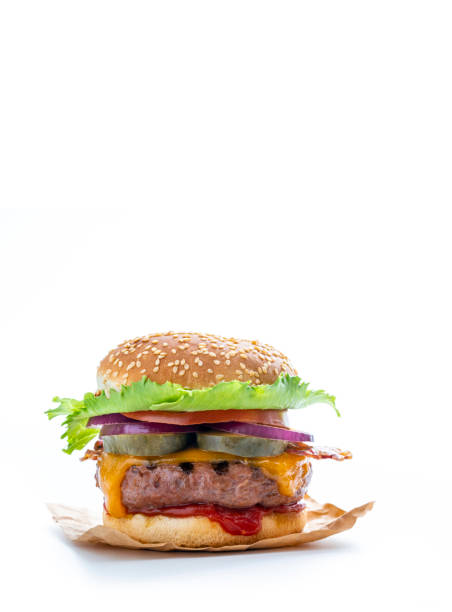 istock Cheeseburger Burger Hamburger with cheddar cheese and bacon, salad, onion, pickles and tomato isolated on white 1328324986